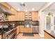 Well-equipped kitchen with stainless steel appliances, custom cabinetry, and stylish backsplash for modern appeal at 2246 E Glenrosa Ave, Phoenix, AZ 85016