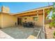 Covered patio with a dining table, ceiling fan, and access to the backyard for outdoor enjoyment at 2246 E Glenrosa Ave, Phoenix, AZ 85016