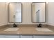 Modern bathroom with granite countertops, double sinks, and black fixtures at 2311 N Loma Vis, Mesa, AZ 85213