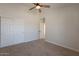 Bedroom featuring closet with sliding doors and adjoining bathroom at 2311 N Loma Vis, Mesa, AZ 85213