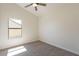 Bright bedroom with neutral walls, carpet, ceiling fan and window at 2311 N Loma Vis, Mesa, AZ 85213