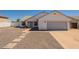 Charming single-story home featuring a two-car garage, low maintenance landscaping, and neutral colors at 2311 N Loma Vis, Mesa, AZ 85213
