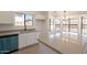 Open kitchen/dining area with stainless steel sink and modern light fixture at 2311 N Loma Vis, Mesa, AZ 85213
