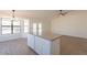 Open kitchen/dining area with granite countertops and modern light fixture at 2311 N Loma Vis, Mesa, AZ 85213