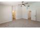 Large main bedroom with ceiling fan, neutral colors and multiple doorways at 2311 N Loma Vis, Mesa, AZ 85213