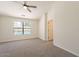 Spacious main bedroom with ceiling fan and views of the pool at 2311 N Loma Vis, Mesa, AZ 85213