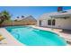 Sparkling backyard pool with diving board and convenient access to the house at 2311 N Loma Vis, Mesa, AZ 85213