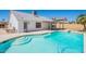Sparkling pool featuring a multi-step entry, cool decking and a covered patio, perfect for outdoor entertaining at 2311 N Loma Vis, Mesa, AZ 85213