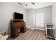 Cozy bedroom boasts ample natural light, wood flooring, and a charming roll-top desk at 2537 E Vista Bonita Dr, Phoenix, AZ 85024