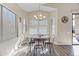 Cozy dining area with wood table, chandelier, and bright natural light at 2537 E Vista Bonita Dr, Phoenix, AZ 85024