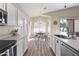 A dining area with natural light, wood floors, and modern light fixture at 2537 E Vista Bonita Dr, Phoenix, AZ 85024