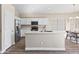 A kitchen showcasing an island, stainless steel refrigerator, and white cabinetry at 2537 E Vista Bonita Dr, Phoenix, AZ 85024