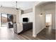 Living room with a ceiling fan, grey sofas, and access to the backyard pool at 2537 E Vista Bonita Dr, Phoenix, AZ 85024
