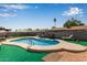 Relaxing backyard oasis featuring a sparkling pool, lounge chairs, and lush landscaping at 2541 E Inverness Ave, Mesa, AZ 85204