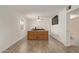 A well lit bedroom with hard surface floors and a large entertainment center at 2541 E Inverness Ave, Mesa, AZ 85204