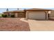 Charming single-story brick home with a spacious two-car garage and low-maintenance front yard at 2541 E Inverness Ave, Mesa, AZ 85204