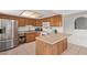 The well-equipped kitchen features a breakfast bar and stainless steel appliances at 2541 E Inverness Ave, Mesa, AZ 85204