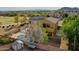 Aerial view of the home featuring a pool and solar panels in a desert landscape at 25453 N 68Th Ln, Peoria, AZ 85383