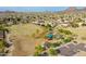 Expansive aerial view showcasing the neighborhood park and surrounding community at 25453 N 68Th Ln, Peoria, AZ 85383