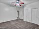Neutral bedroom featuring a ceiling fan and closet with sliding doors at 25453 N 68Th Ln, Peoria, AZ 85383