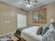 Cozy bedroom with a queen bed, window with shutters, and natural light at 25453 N 68Th Ln, Peoria, AZ 85383