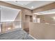 Upstairs hallway with carpet flooring and neutral-toned walls at 25453 N 68Th Ln, Peoria, AZ 85383