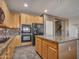 Spacious kitchen featuring a large island, modern appliances, and plenty of storage at 25453 N 68Th Ln, Peoria, AZ 85383