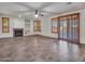 Bright living room featuring a fireplace and sliding glass door at 25453 N 68Th Ln, Peoria, AZ 85383