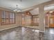 Open-concept living room featuring updated flooring, unique windows with shutters, and neutral colors at 25453 N 68Th Ln, Peoria, AZ 85383