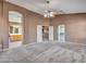 Expansive main bedroom featuring a ceiling fan, walk-in closet, and an en-suite bathroom at 25453 N 68Th Ln, Peoria, AZ 85383