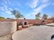 Outdoor kitchen area, featuring a stone pizza oven, BBQ, and concrete patio at 25453 N 68Th Ln, Peoria, AZ 85383