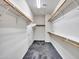 A walk-in closet with hanging racks provides ample storage space for clothing and accessories at 25453 N 68Th Ln, Peoria, AZ 85383