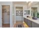 Bathroom displays modern vanity and large mirrors, creating a bright and open space at 25800 N 140Th Ln, Surprise, AZ 85387