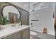 Bathroom showcasing a modern vanity, beautiful tile work, and a shower-tub combination at 25800 N 140Th Ln, Surprise, AZ 85387