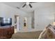 Bedroom with a dresser and closet doors is connected to the Primary bathroom at 25800 N 140Th Ln, Surprise, AZ 85387