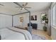 Bedroom featuring a canopy bed, sleek dresser, and a modern plant to complement the decor at 25800 N 140Th Ln, Surprise, AZ 85387