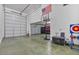 Spacious garage featuring an American flag, basketball hoop, and ample storage at 25800 N 140Th Ln, Surprise, AZ 85387