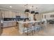 Stylish kitchen with a large island and barstool seating, stainless appliances at 25800 N 140Th Ln, Surprise, AZ 85387