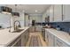 Spacious kitchen with stainless steel appliances, a large island, and sleek countertops at 25800 N 140Th Ln, Surprise, AZ 85387
