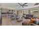 Open concept living and kitchen area with an island and pendant lighting, perfect for modern living at 25800 N 140Th Ln, Surprise, AZ 85387