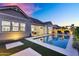 Beautiful backyard with a sparkling pool, lush landscaping, and patio seating at 2617 S Jeffry St, Gilbert, AZ 85295