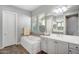 Relaxing bathroom features a soaking tub, dual sink vanity, and decorative tile accents at 2617 S Jeffry St, Gilbert, AZ 85295