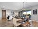 Bright dining room with sliding glass doors to patio and modern chandelier at 2617 S Jeffry St, Gilbert, AZ 85295