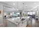 Bright kitchen with island and seating that opens to the dining and living areas at 2617 S Jeffry St, Gilbert, AZ 85295