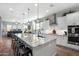 Spacious open concept kitchen featuring an oversized island with seating and modern appliances at 2617 S Jeffry St, Gilbert, AZ 85295