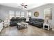 Cozy living room featuring a comfortable sectional sofa and an abundance of natural light at 2617 S Jeffry St, Gilbert, AZ 85295