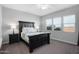 Serene bedroom with neutral color palette, plush carpet, and large windows providing natural light at 2617 S Jeffry St, Gilbert, AZ 85295