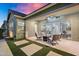 Relaxing outdoor patio with comfortable seating and views of the home and landscaped backyard at 2617 S Jeffry St, Gilbert, AZ 85295