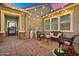 Relaxing outdoor patio area featuring wicker furniture and ambient string lights at 2617 S Jeffry St, Gilbert, AZ 85295