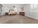 Large bedroom is filled with natural light, featuring a comfortable bed and ample closet space at 30246 N 123Rd Ln, Peoria, AZ 85383